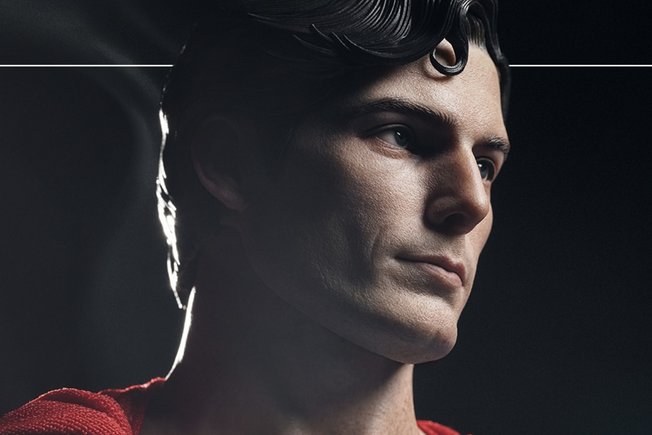 A close-up profile shot of the InArt Superman 1/6 scale collectible figure featuring the likeness of Christopher Reeve with his iconic spit-curl hairstyle.